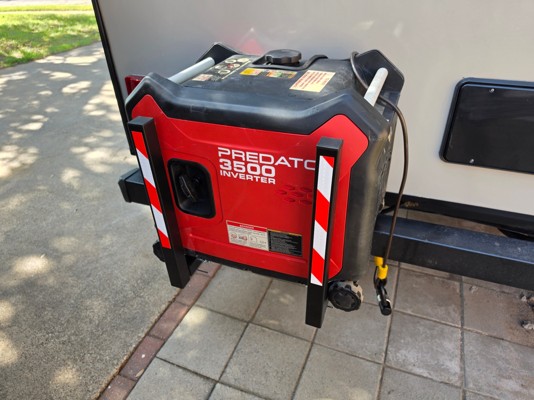 Close-up of the GenCaddy supporting a portable generator