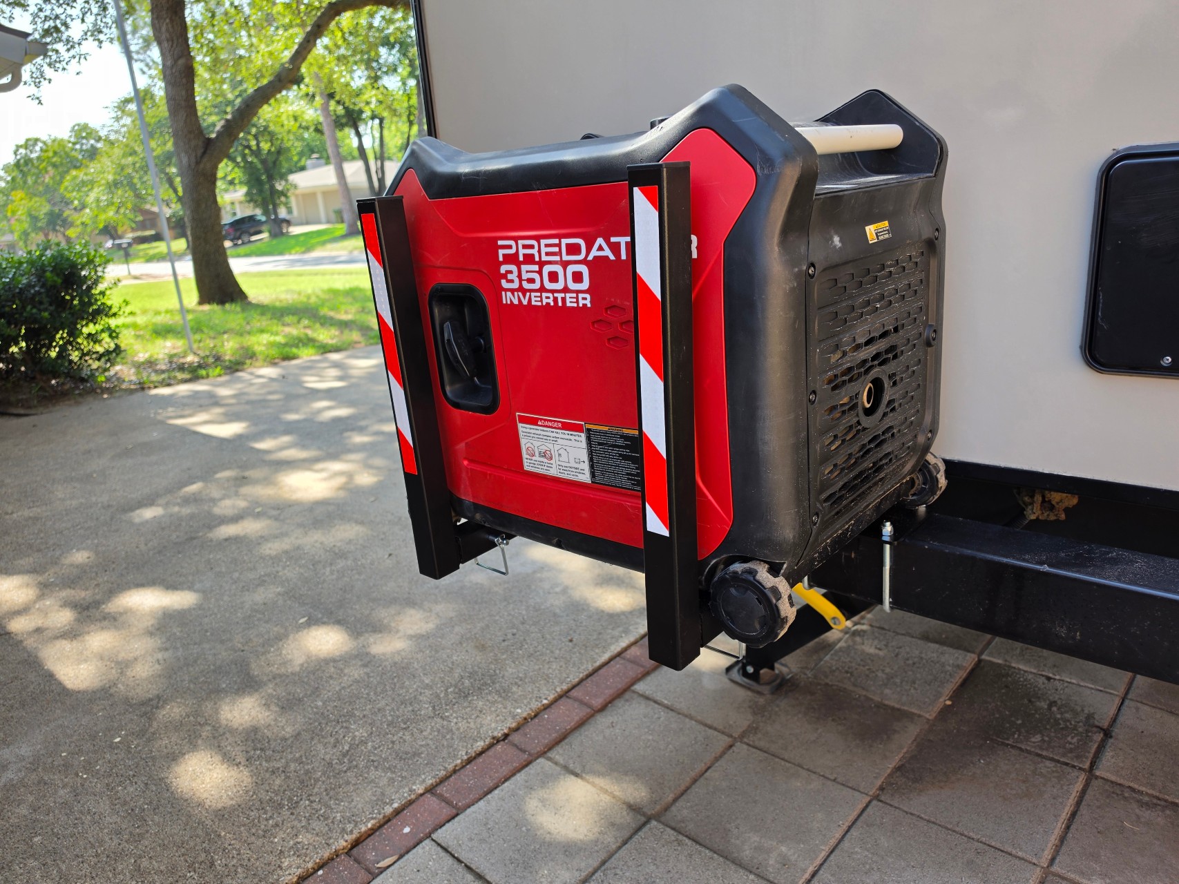 Portable generator secured in the GenCaddy on an RV bumper