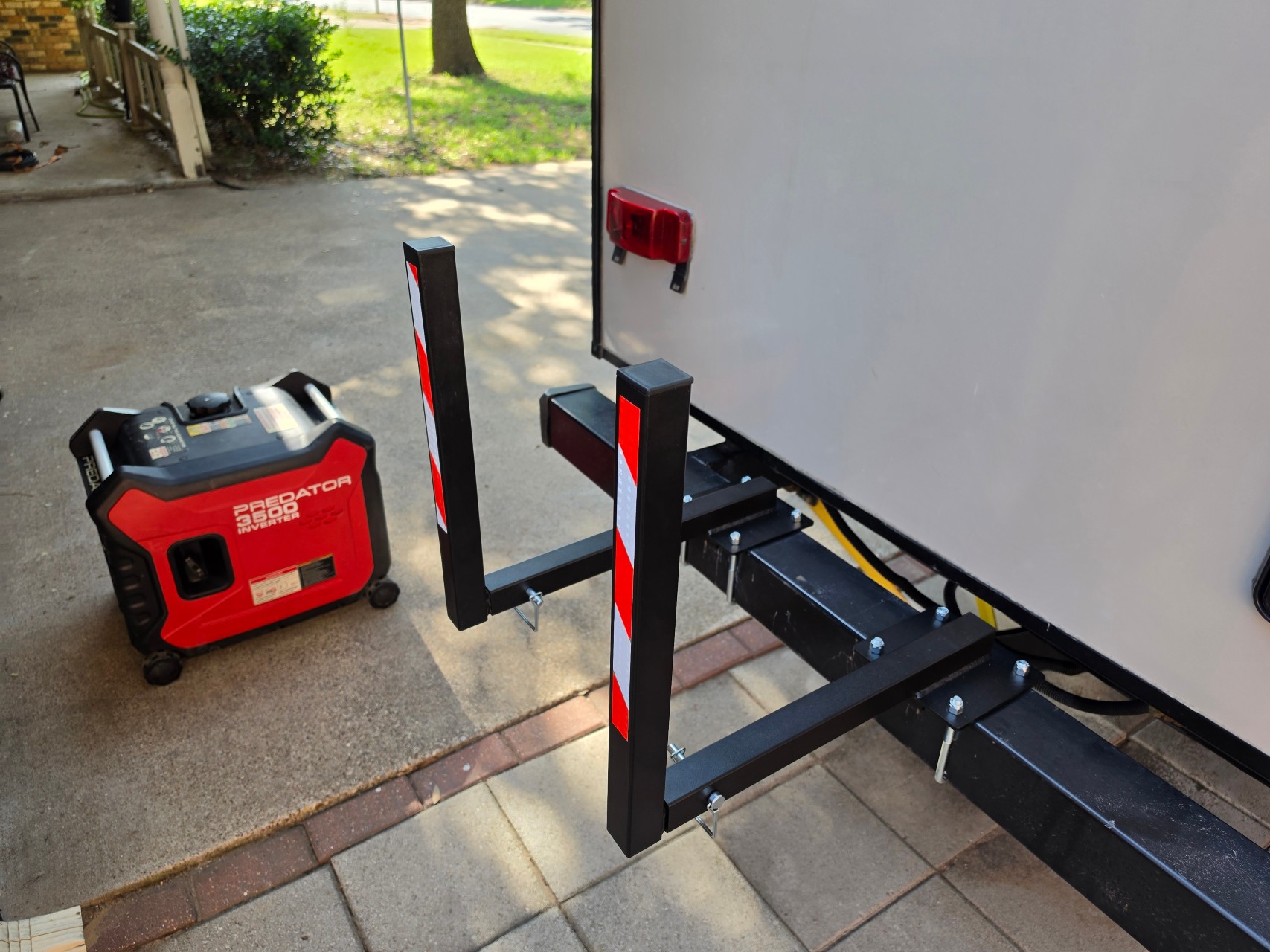 GenCaddy arms mounted to a travel trailer's square rear bumper